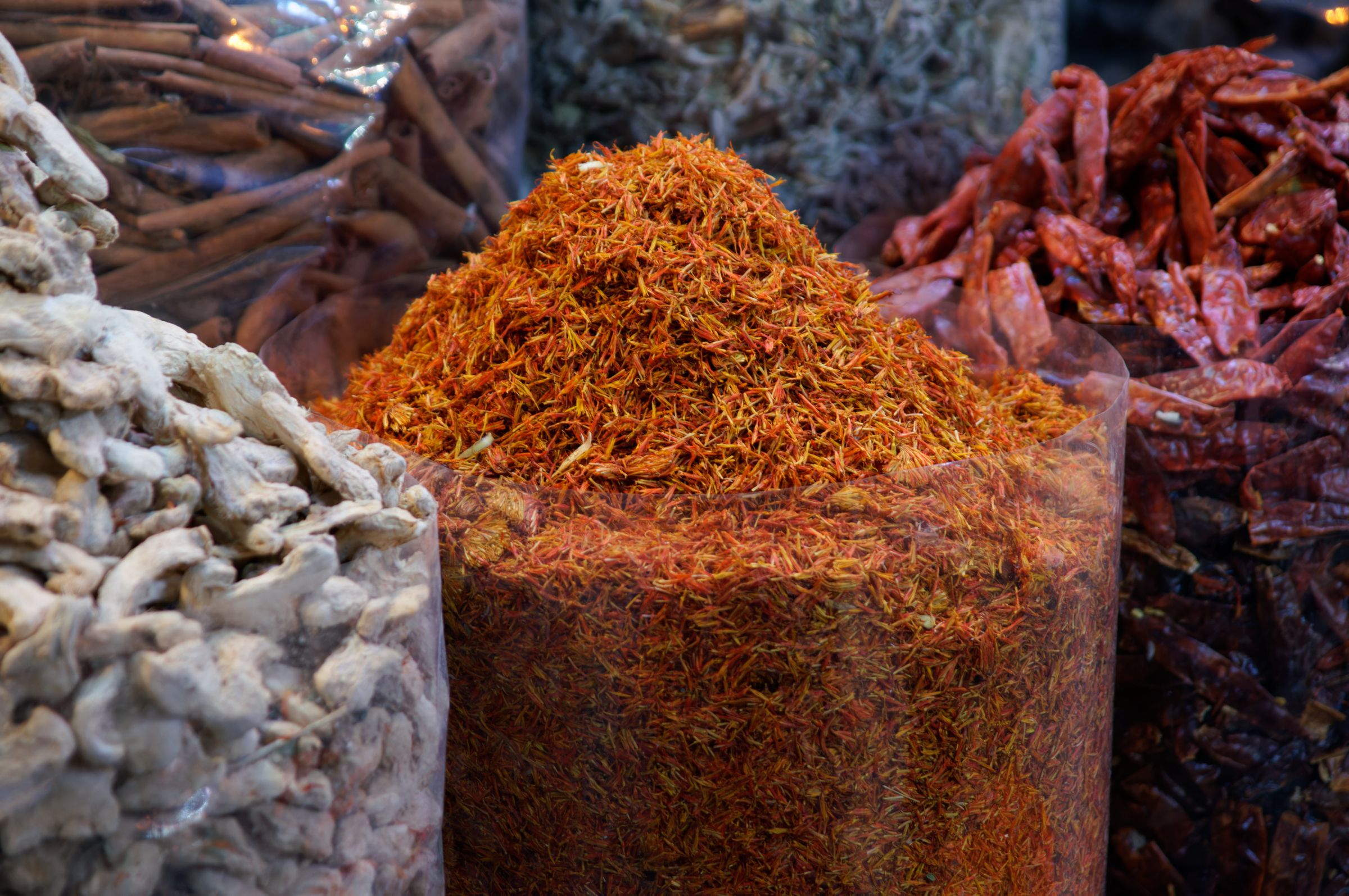 Open bags of whole and ground spices